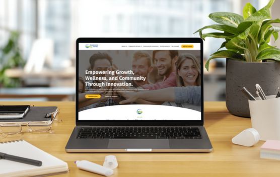 Laptop mockup showing the redesigned Progressive Life Centre website with a modern, mobile-friendly design that highlights programs, bookings, and clear calls to action.